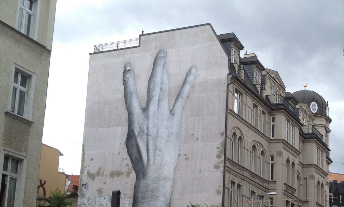 Large scale paste up Street Art Mural in Berlin Mitte