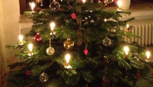 CHristmas Tree lit with real candles in Berlin